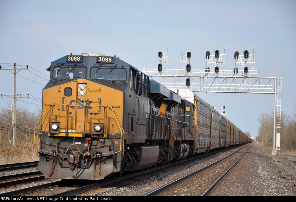 Westbound vehicle train slows to enter Frontier Yard